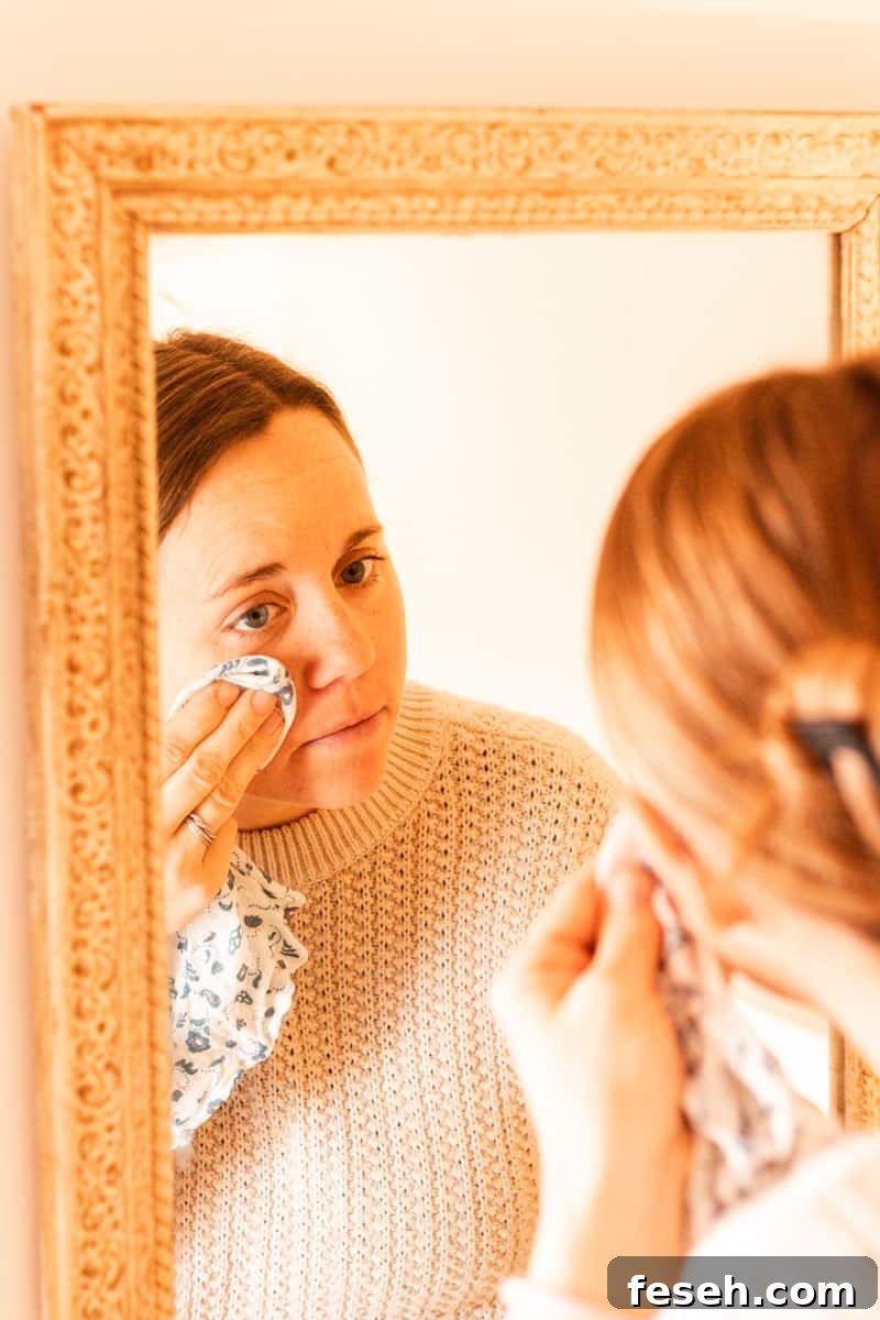 Wiping off the face mask with a damp towel.