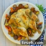roasted spatchcock chicken and roasted vegetables on white platter