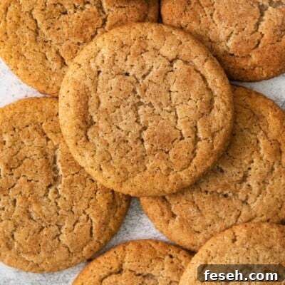 almond flour snickerdoodles stacked on a countertop