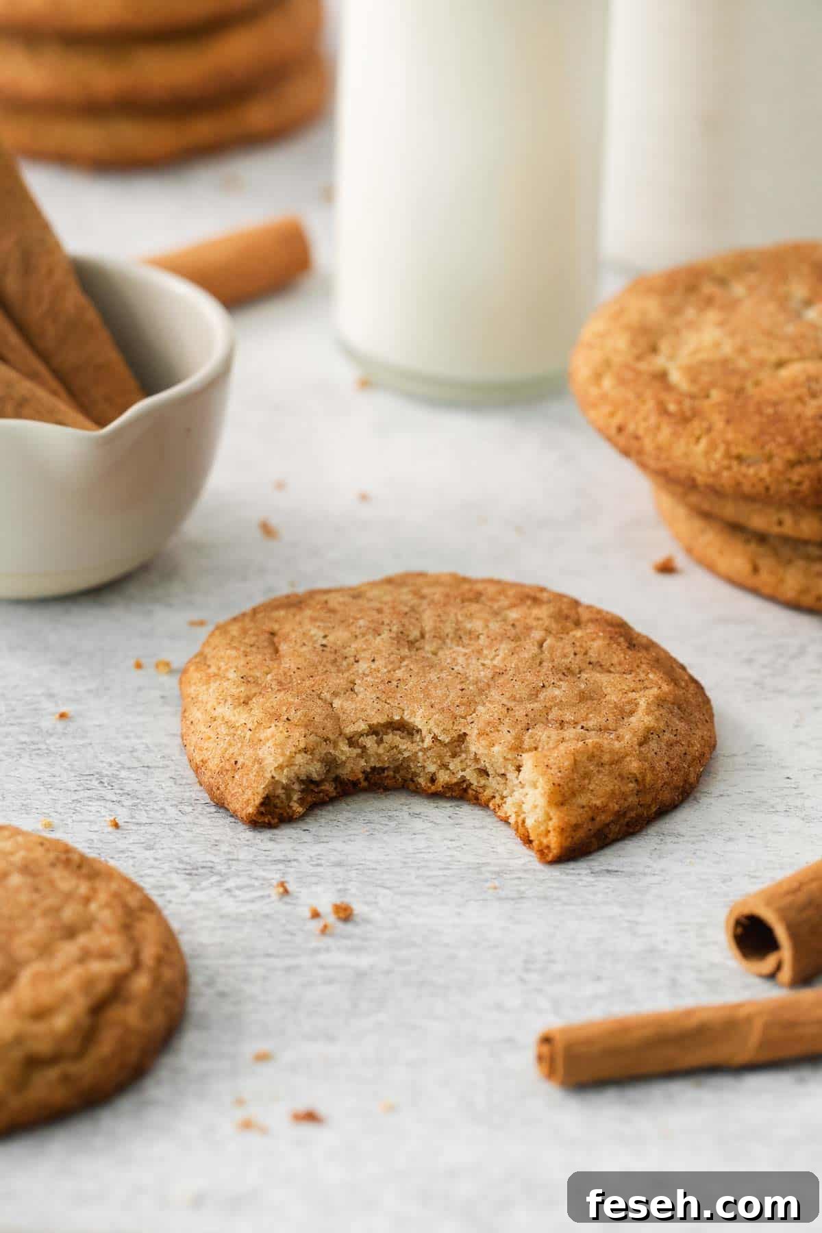 an almond flour snickerdoodle with a bite taken out of it