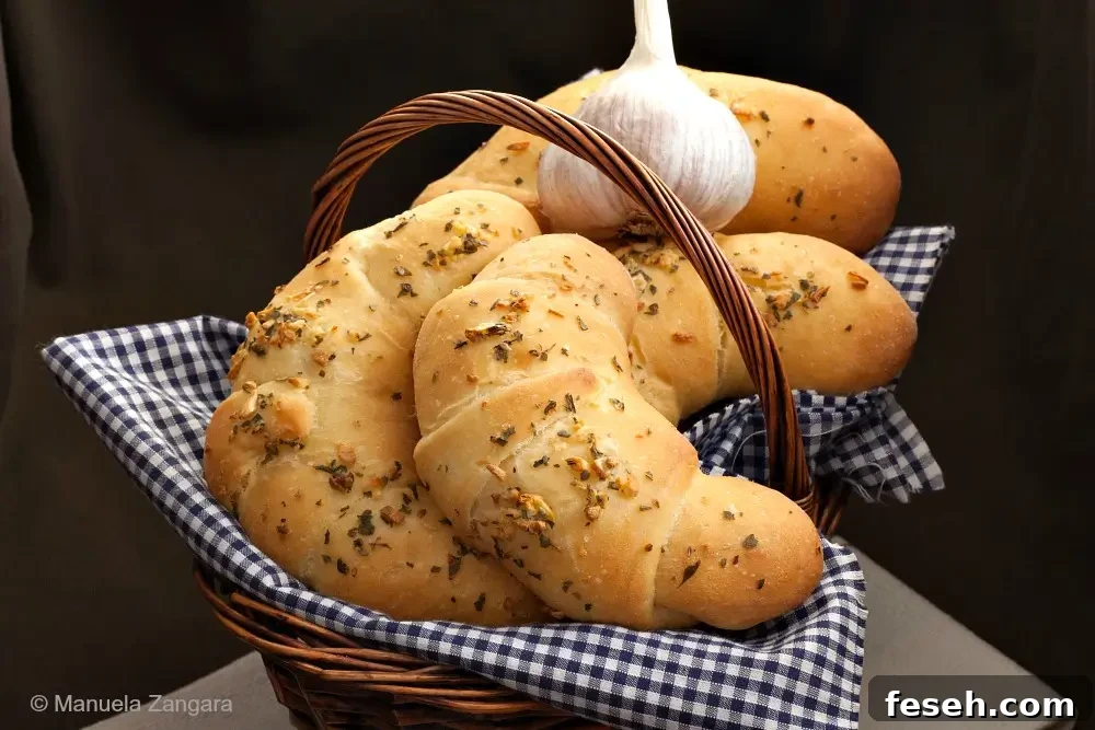 Italian garlic croissants served in a bread basket.