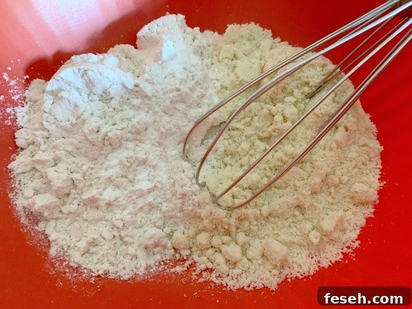 The dry ingredients in a red bowl.