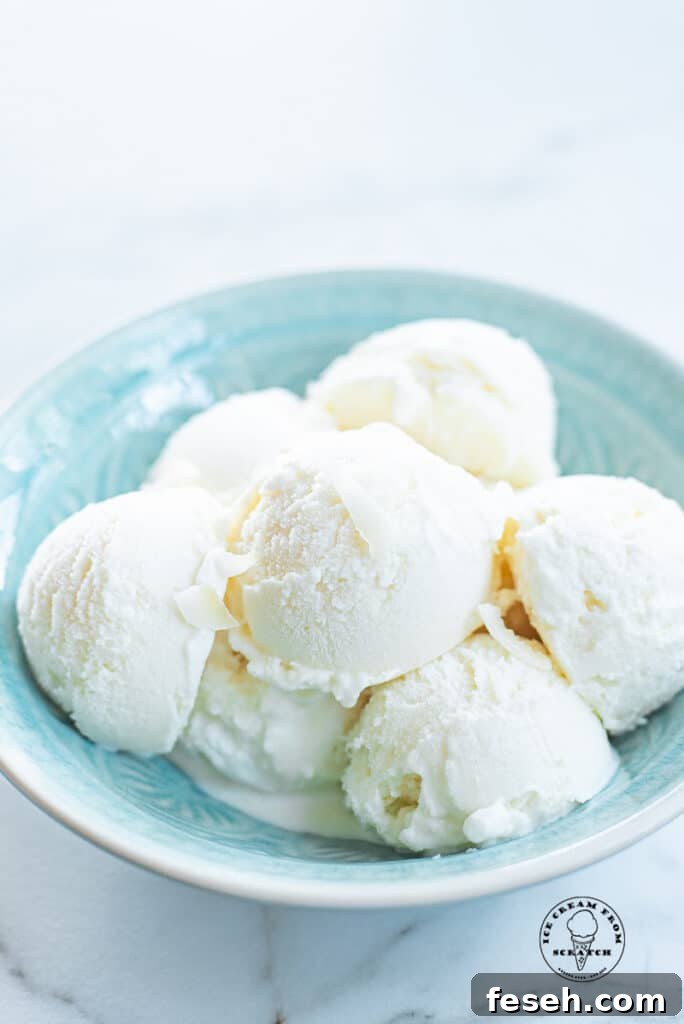 scoops of coconut sorbet in a blue bowl
