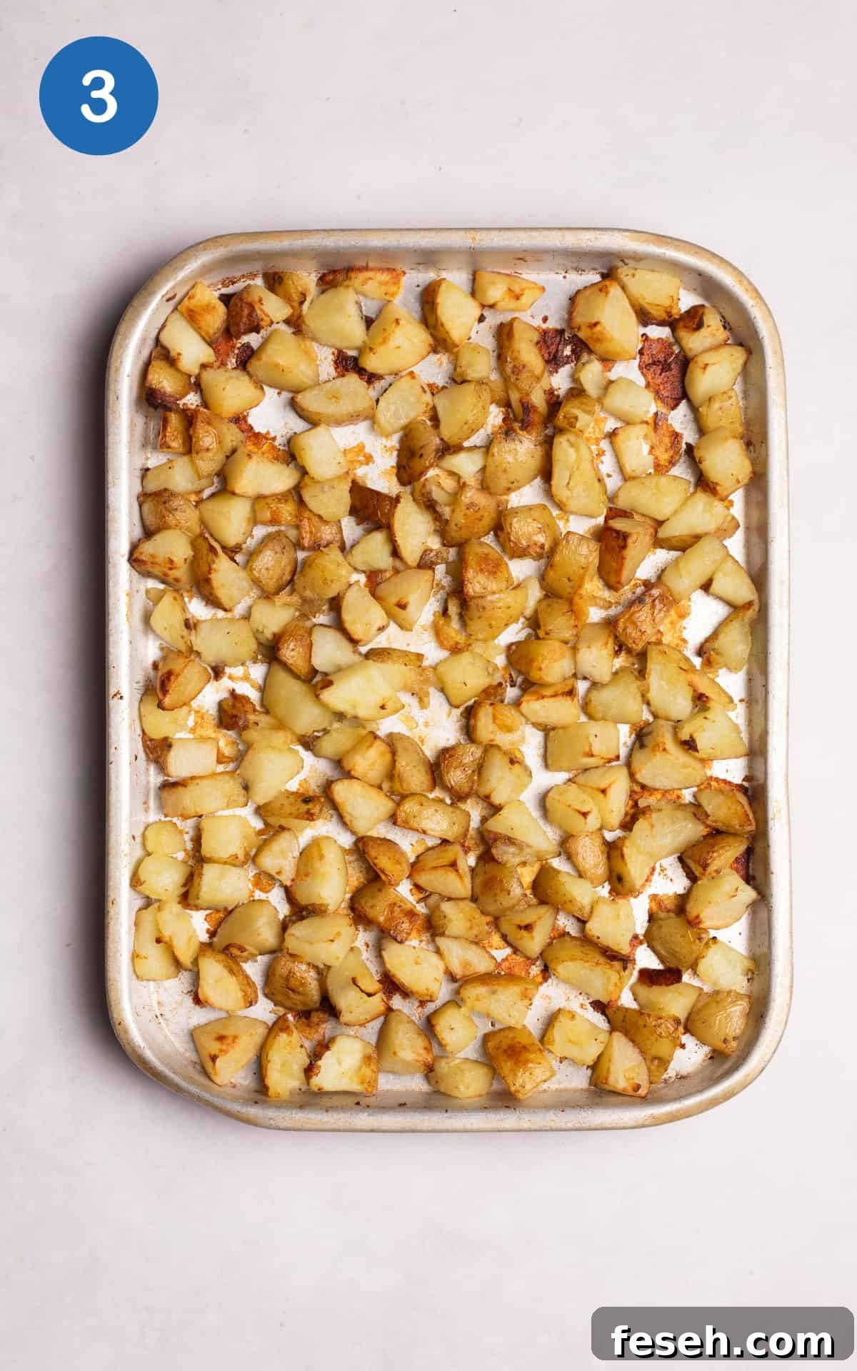 chopped white potatoes in a pan.