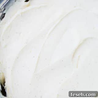 The BEST Cream Cheese Frosting recipe ever! So rich and creamy, perfect for carrot cake, banana cake and whoopie pies!