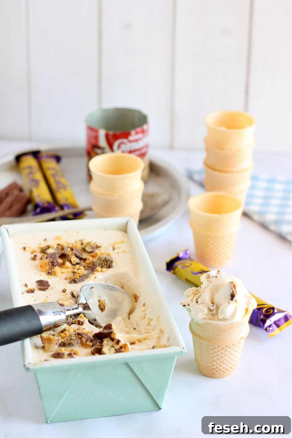 Homemade no churn honeycomb ice cream served in a waffle cone.