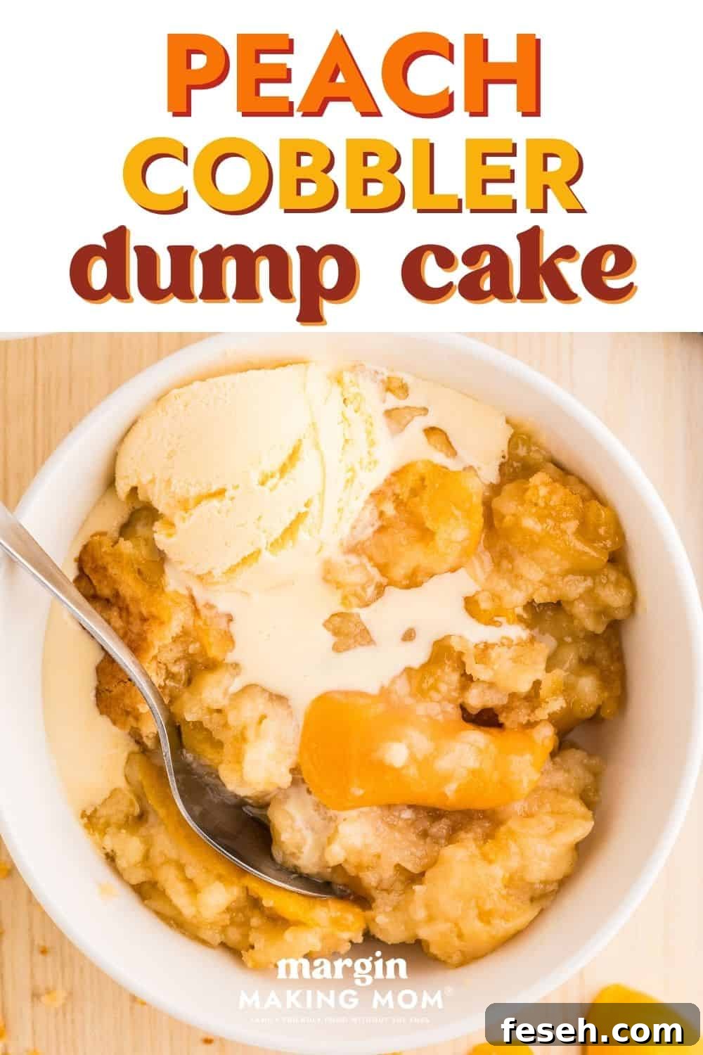 overhead view of a serving of warm peach cobbler dump cake topped with melting vanilla ice cream in a white bowl with a spoon.
