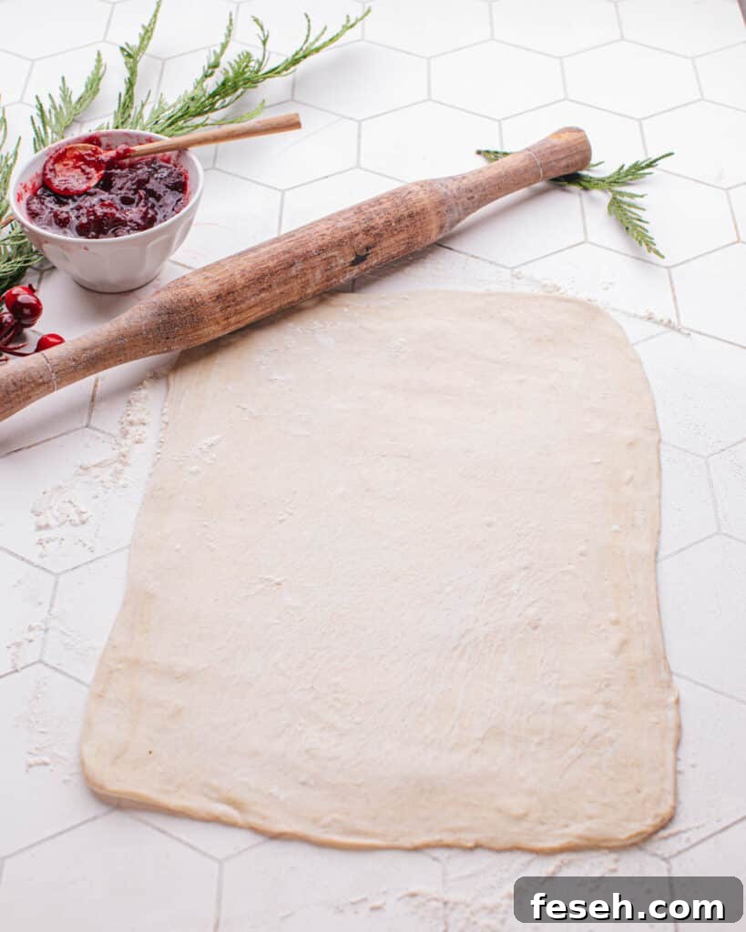 Rolling out puff pastry dough.