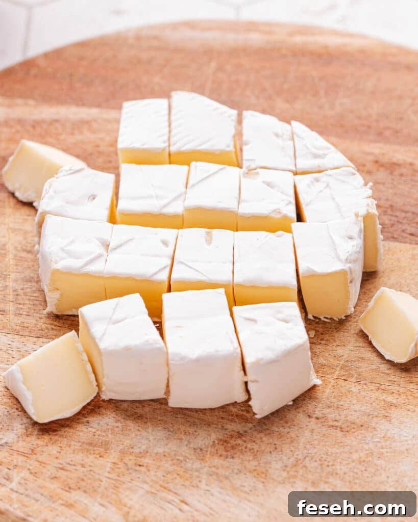 Brie cheese cut in small pieces.