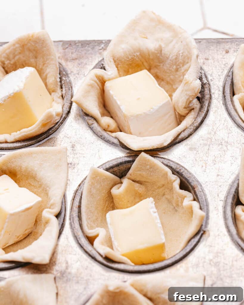 Brie bites in puff pastry in mini muffin tin. 