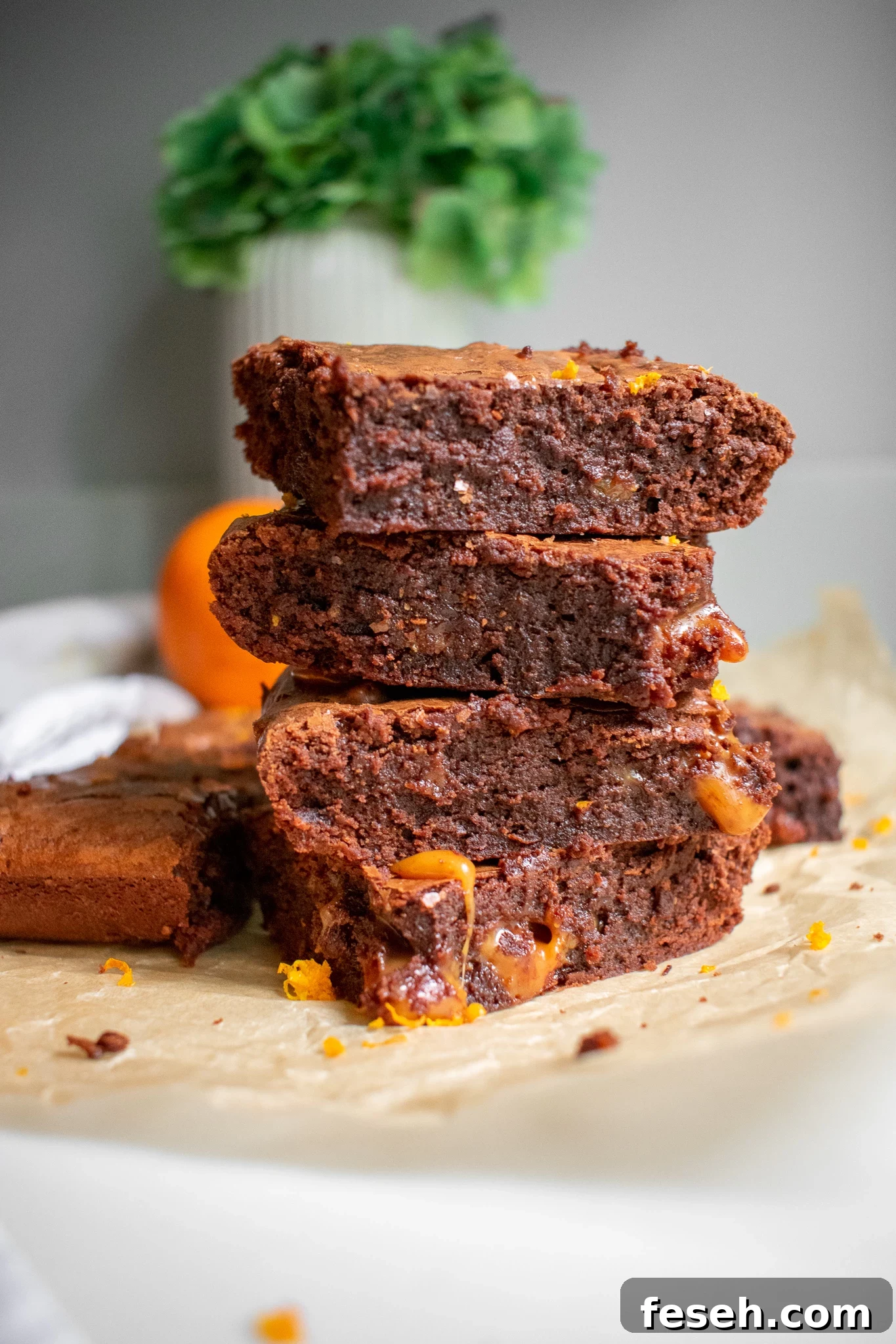 Chocolate orange toffee brownies in a stack.