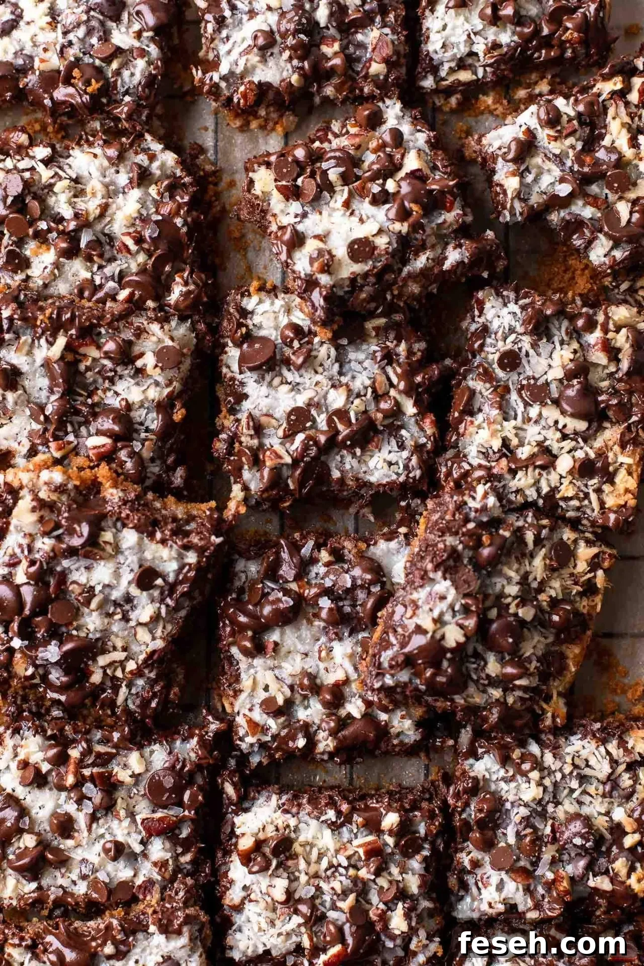 sliced magic bars on parchment lined wire rack