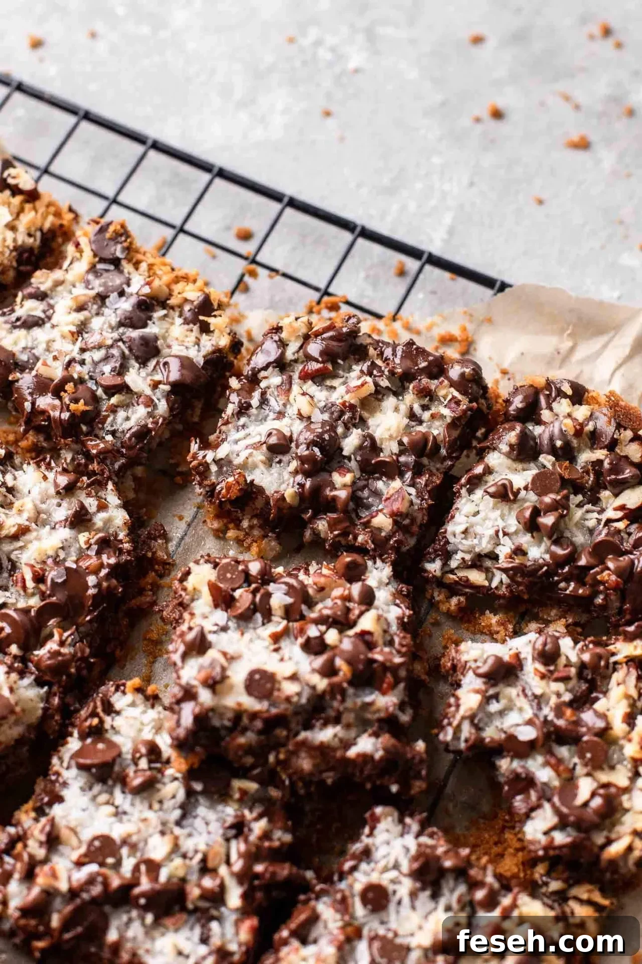 sliced magic bars on parchment lined wire rack-18