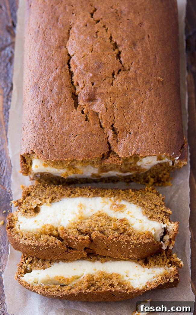 Cream Cheese Filled Pumpkin Bread - This delicious and moist pumpkin bread has a yummy cream cheese filling. It's so good and so, so pretty!