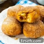 Air Fryer Apple Pie Stuffed Biscuits on a plate.
