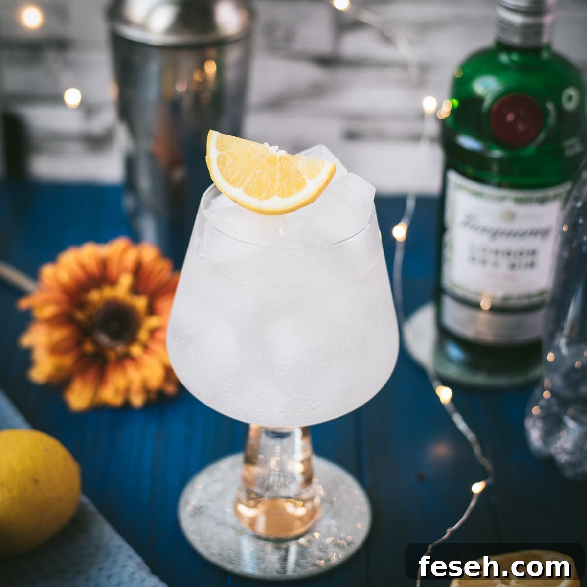 Gorgeous glass filled with a refreshing lemon gin and tonic.