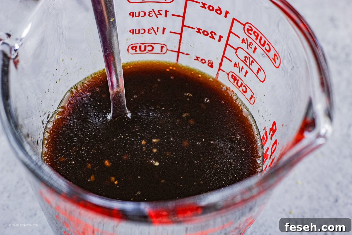 balsamic salad dressing in a measuring cup