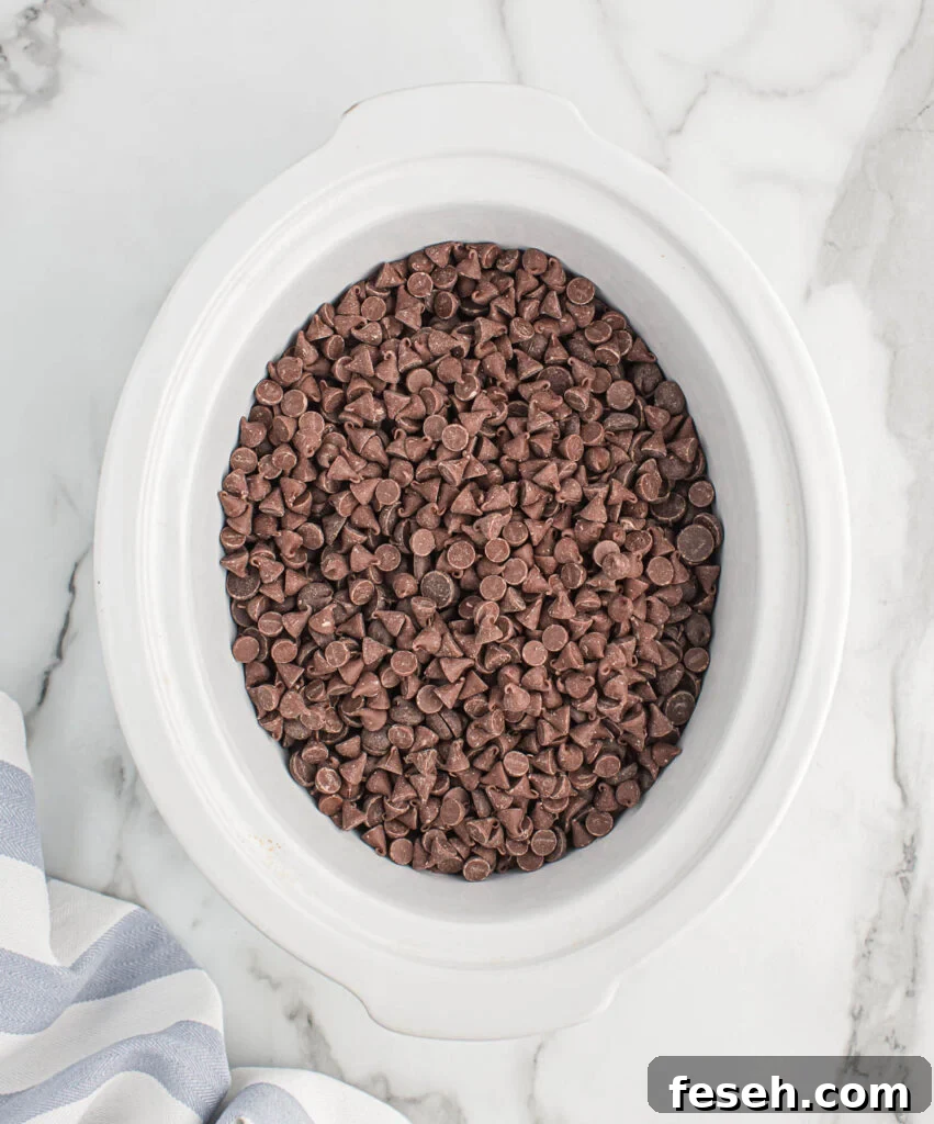 chocolate chips added to the peanuts in the slow cooker