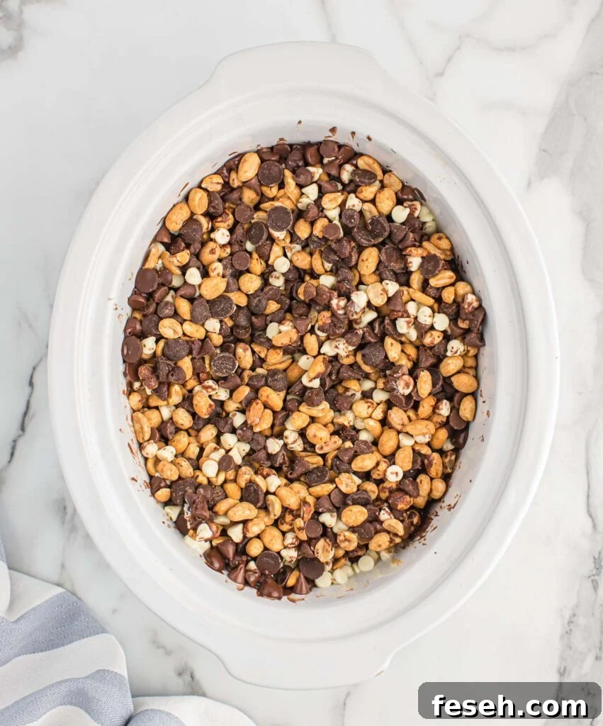 mixing together the peanuts with the chocolate chips