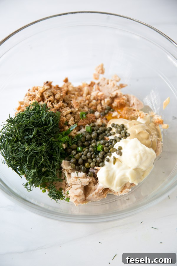 ingredients for pan fried easy canned salmon cakes in a bowl