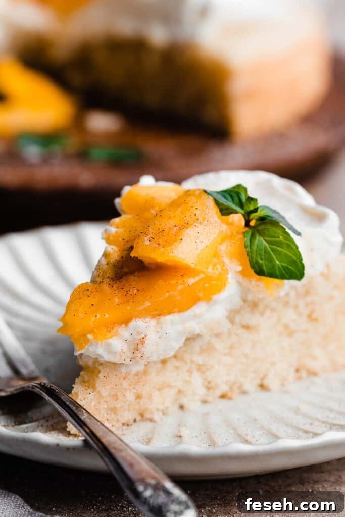 A slice of mango cake on a plate.