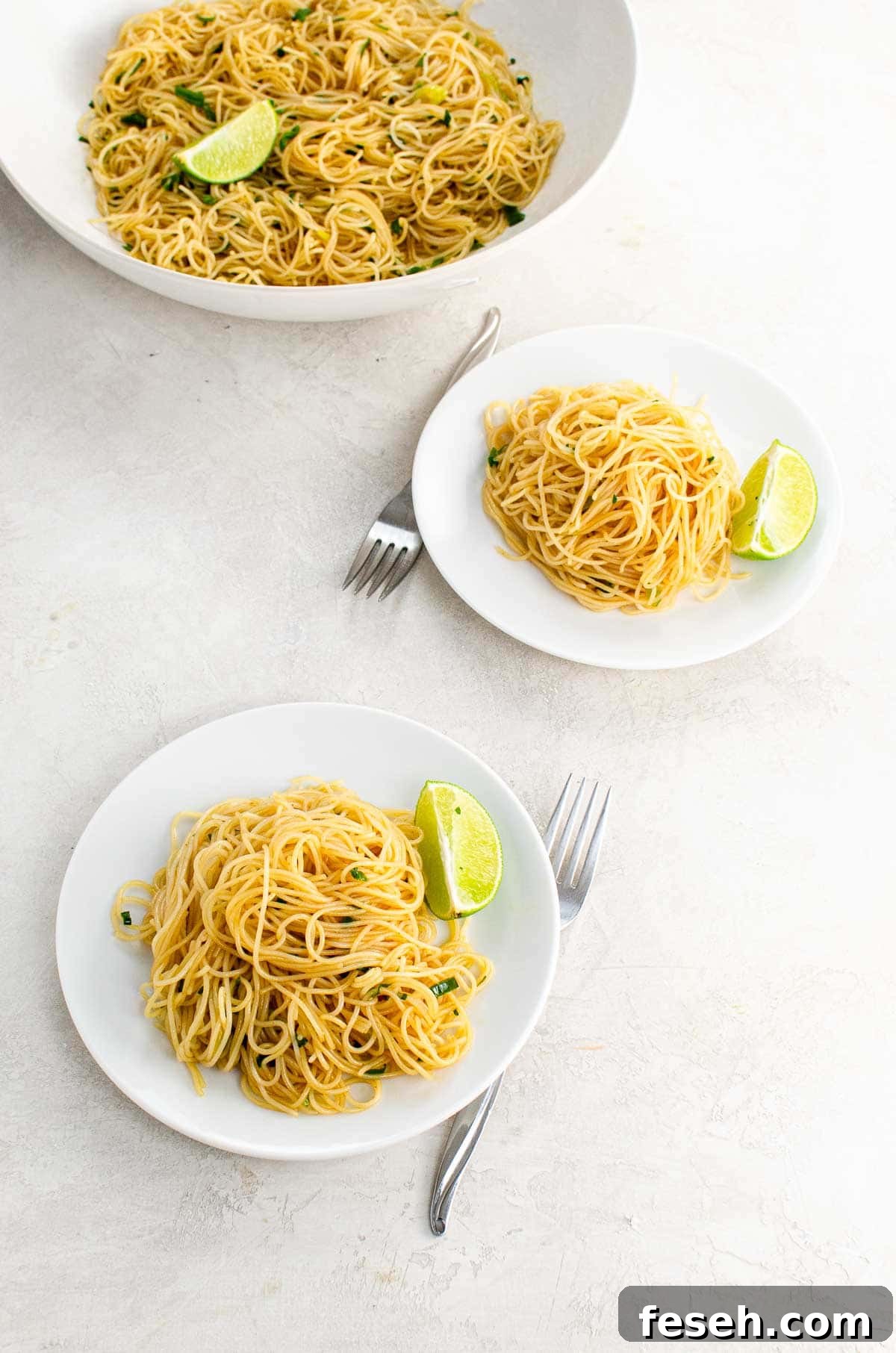 Servings of a vegan rice noodles recipe on white plates