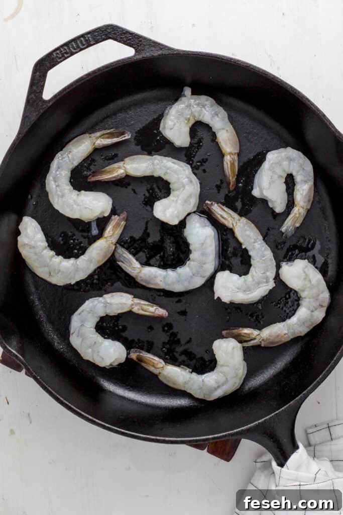 skillet with raw shrimp