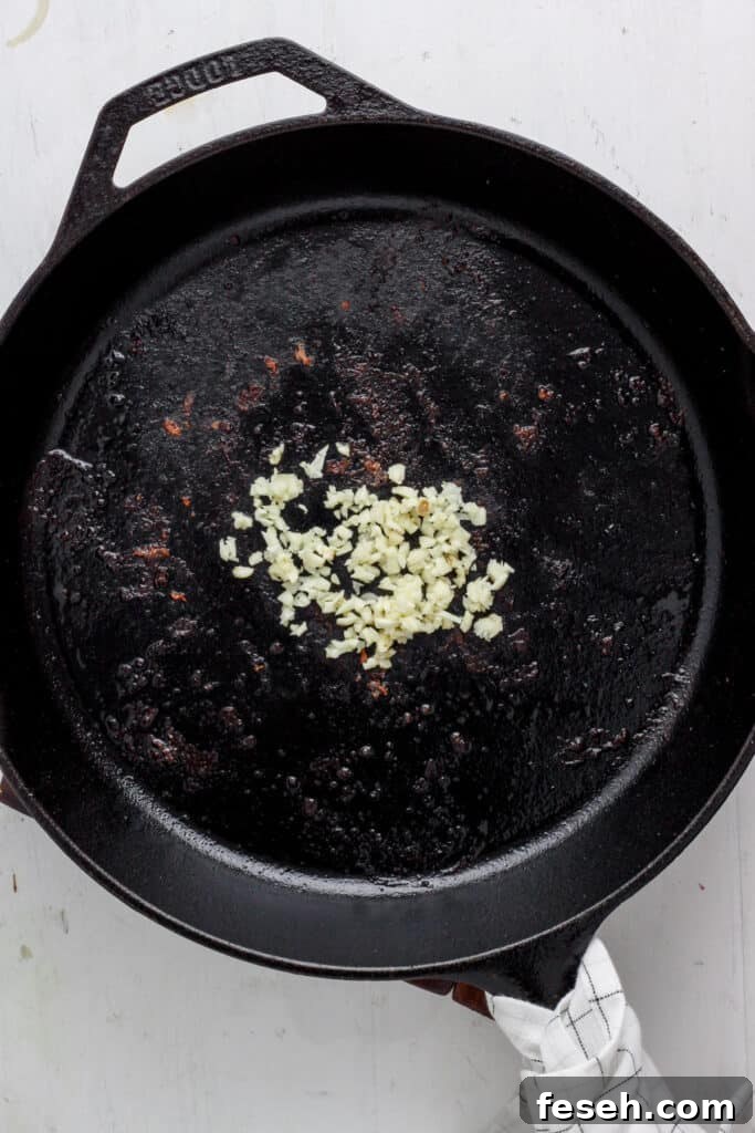 skillet with minced raw garlic