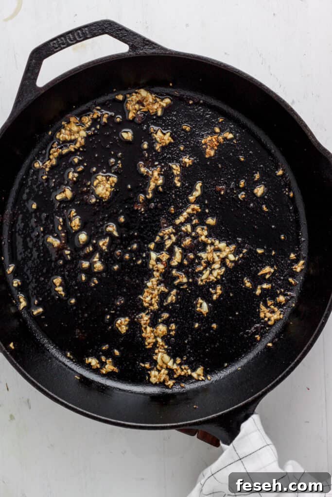 Skillet with minced garlic cooked.