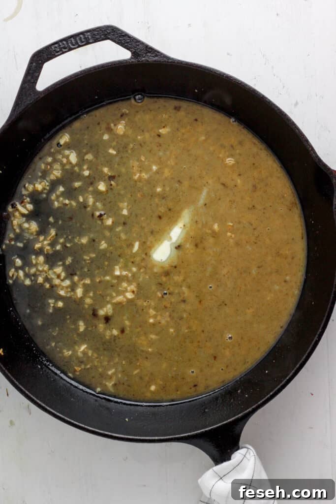 skillet with garlic and white wine and butter.