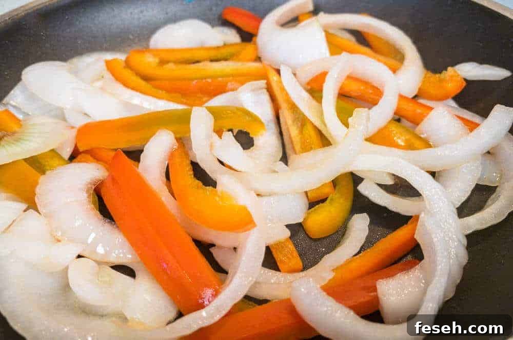 Crispy Juicy Italian Sausage in the Air Fryer 5 Peppers and Onions ready to be sauteed