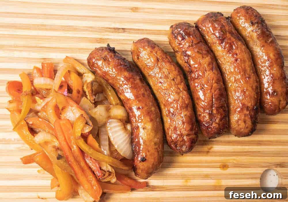 Crispy Juicy Italian Sausage in the Air Fryer 7 Italian sausage with peppers and onions on serving board above view