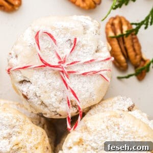 A stack of cookies with a bow tied around them.