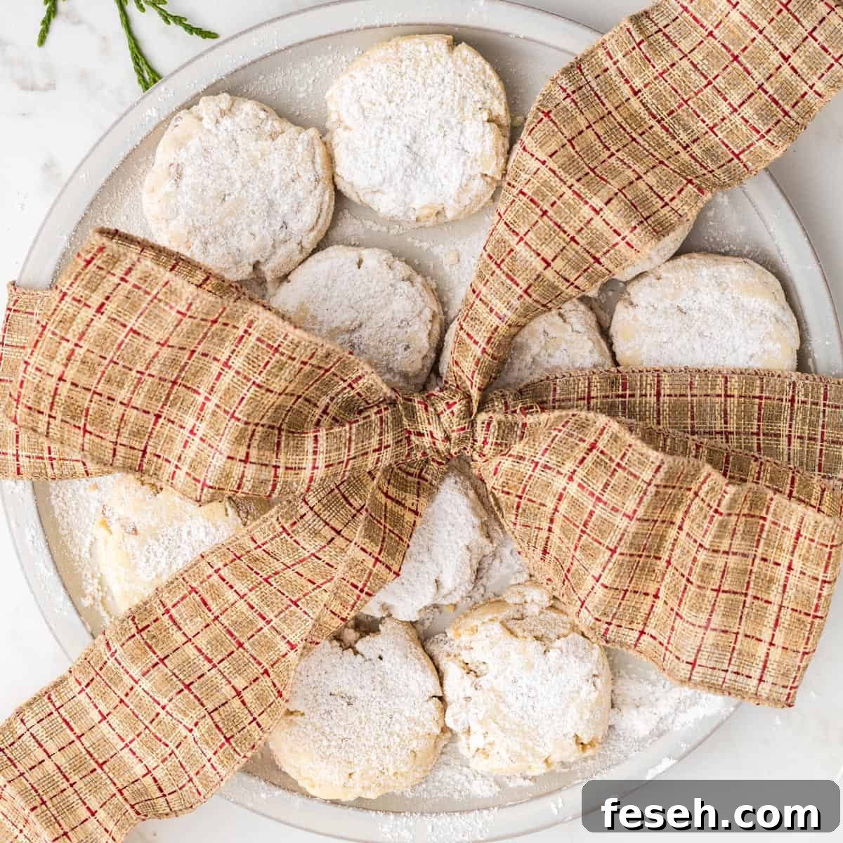 A tray of cookies with a ribbon.