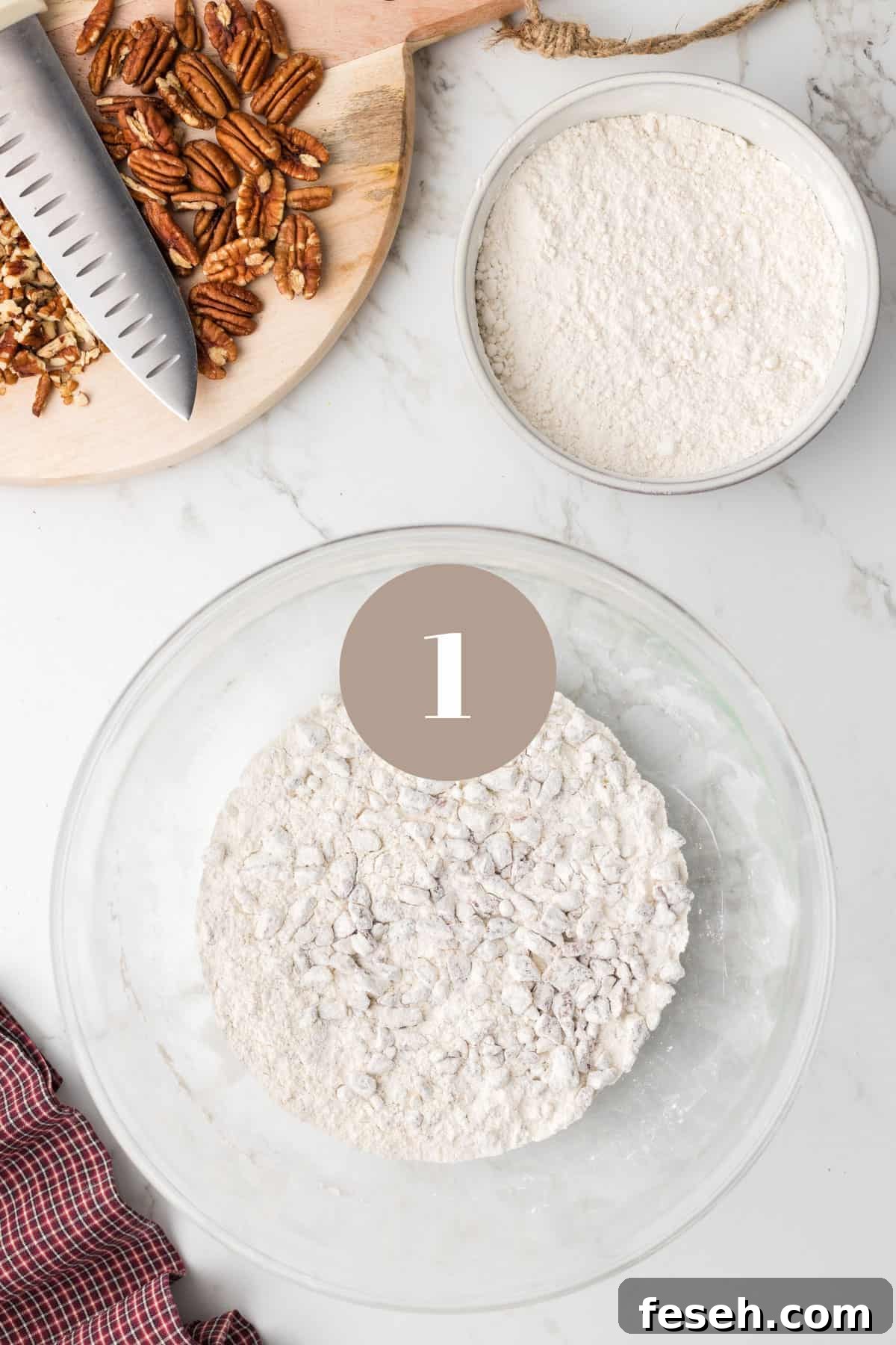 A bowl of flour and some pecans.