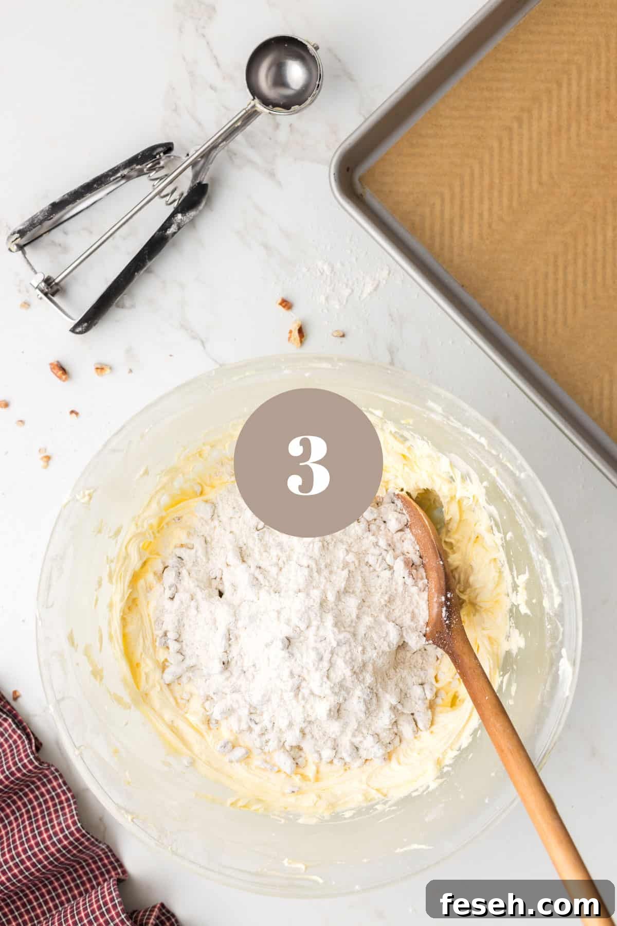 Adding flour to some other ingredients in a mixing bowl.