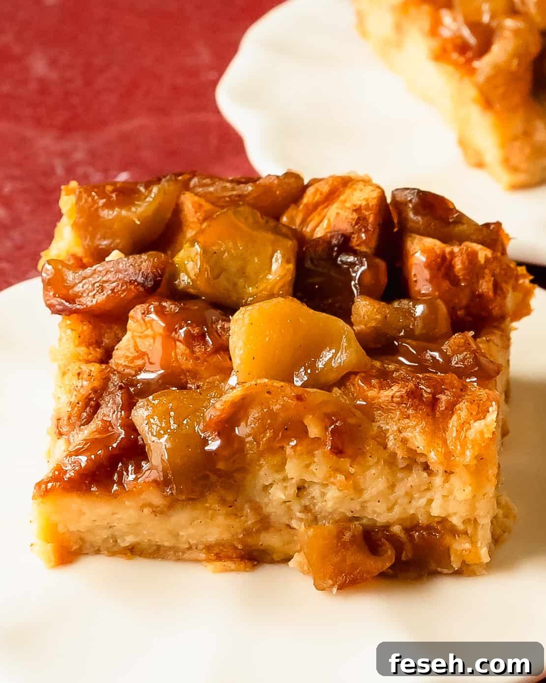 Apple bread pudding is a decadent breakfast or dessert dish made with day old bread and spiced apples soaked in a creamy apple cider custard. Once baked this bread and apple pudding can be topped with salted caramel sauce, creamy vanilla sauce or powdered sugar. 