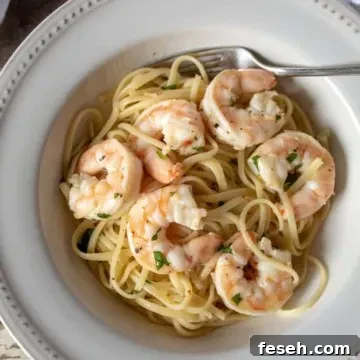 Shrimp Scampi, with linguine in serving bowl with fork.