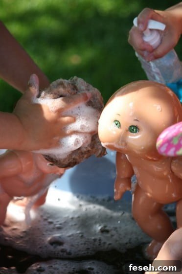 kids shampooing dolls hair