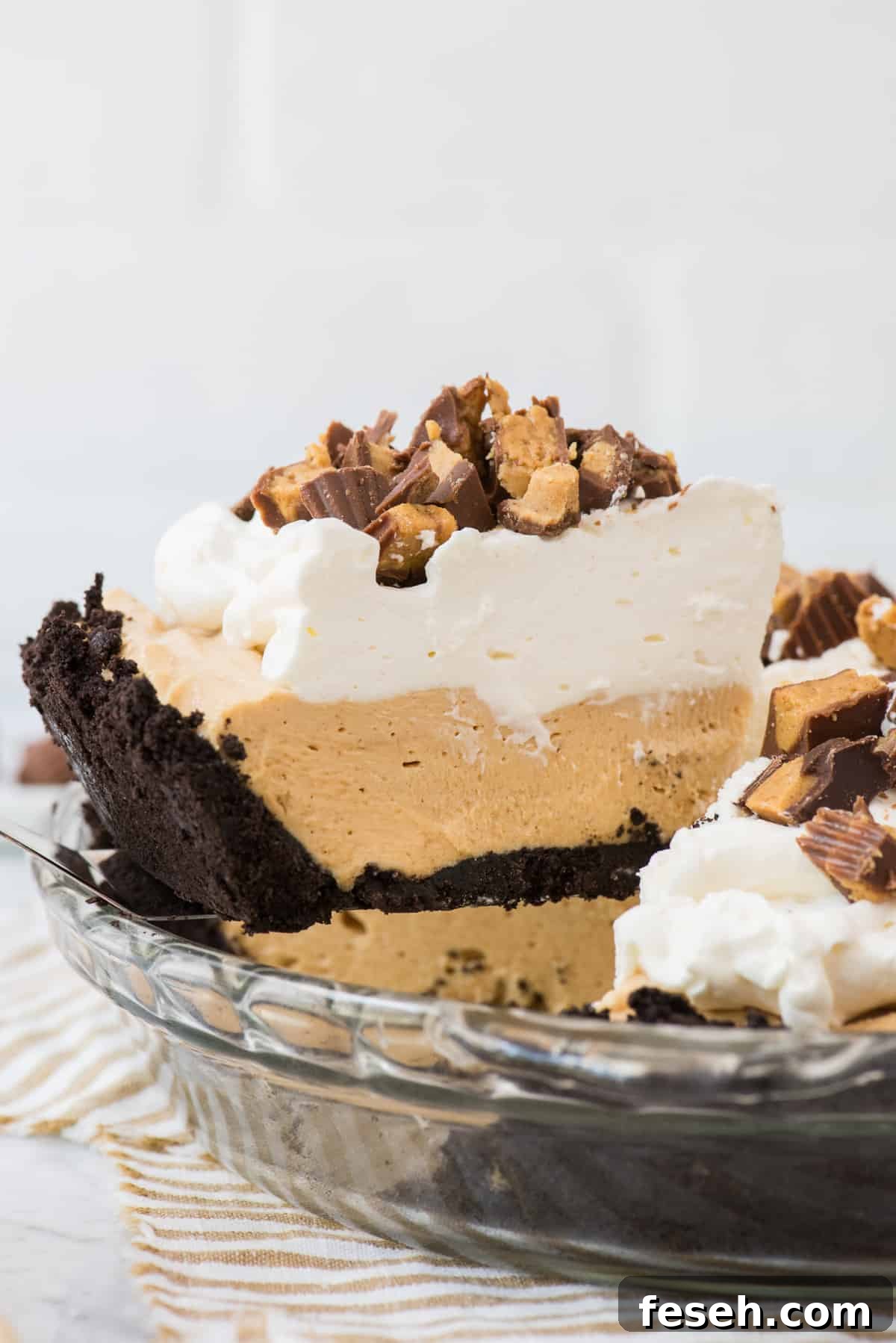 slice of peanut butter pie on spatula being removed from pie pan