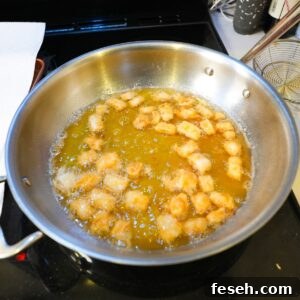 Calamari frying in a pan.