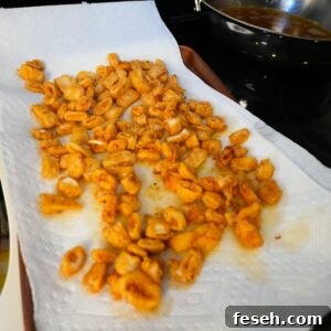 Fried calamari on paper towels.
