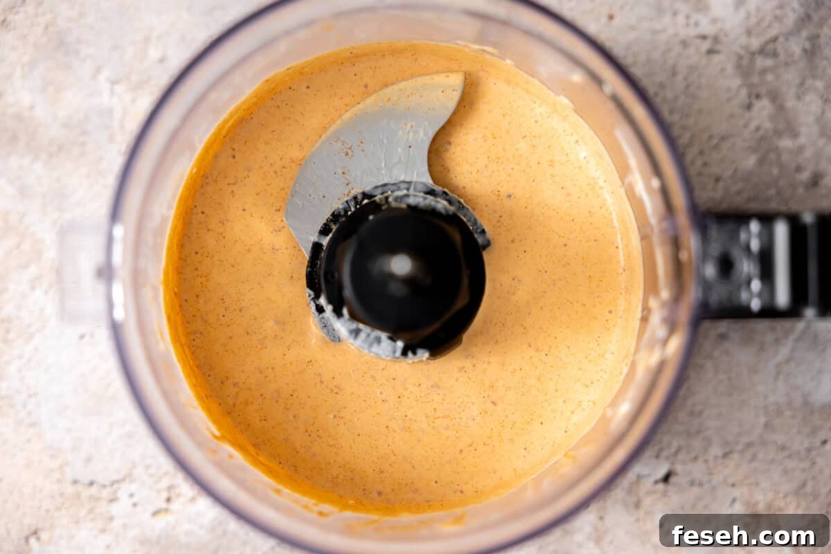 Blended chipotle may in a food processor.