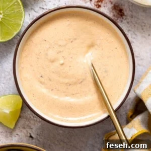 Chipotle Mayo in a bowl with a spoon.