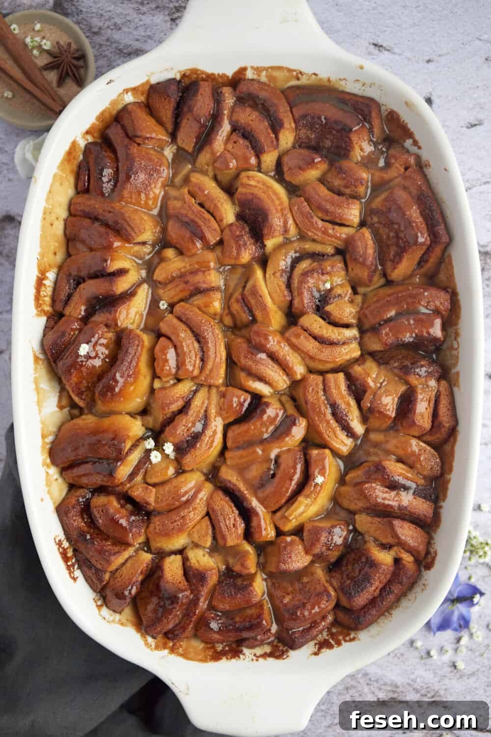 overhead image of baked apple caramel cinnamon rolls