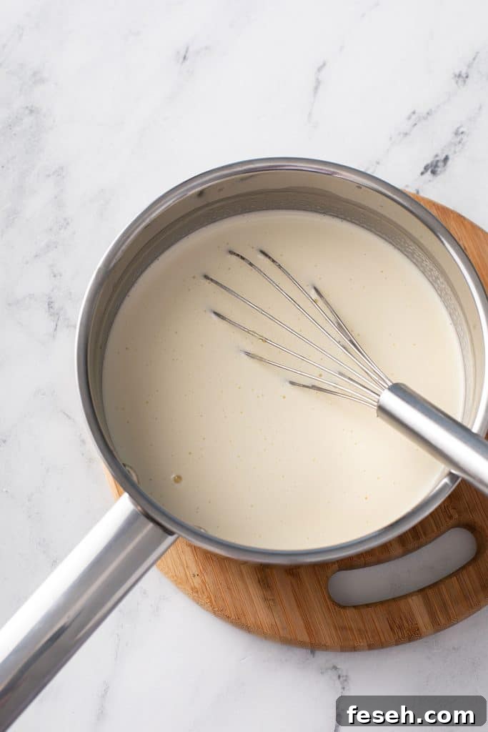 Cooking lemon ice cream mixture in a saucepan