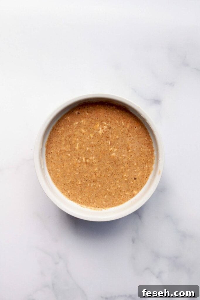 baked oats batter in ramekin before cooking in microwave