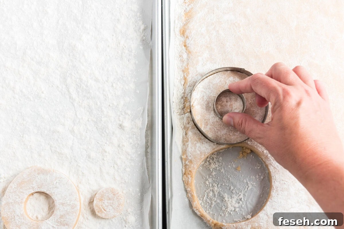 cutting out donut shapes with a biscuit cutter