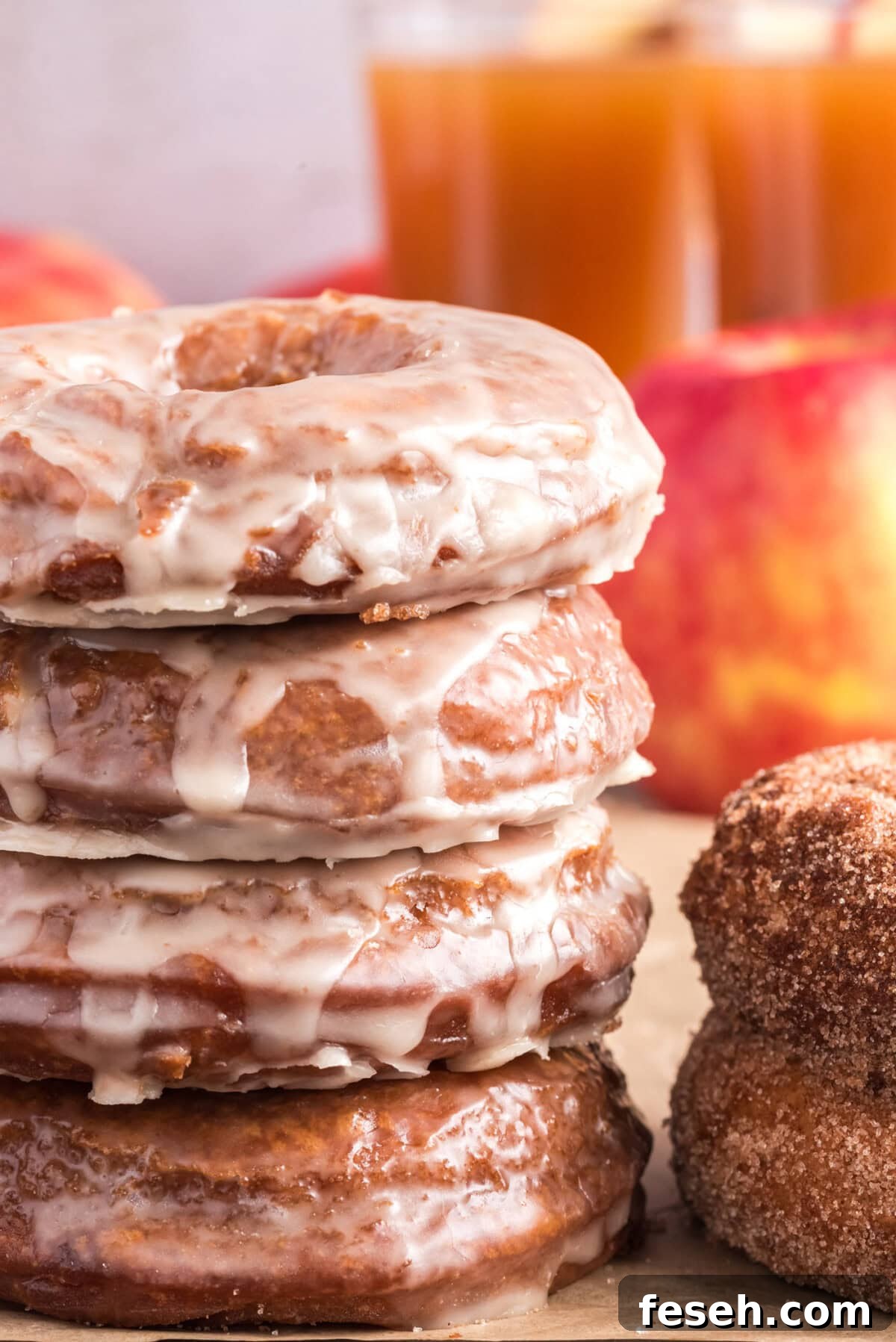 Stack of glazed Apple Cider Doughnuts