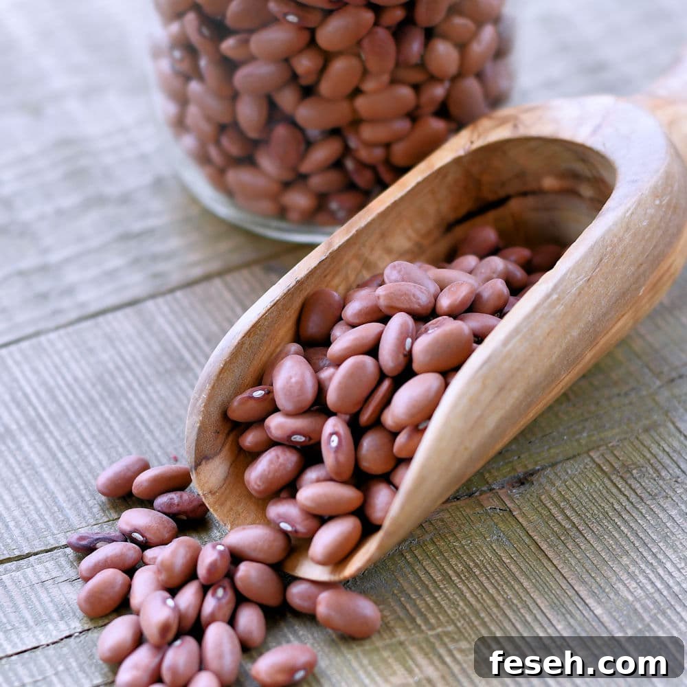 24Bite: Dry pink rosadas beans in jar and wood scoop